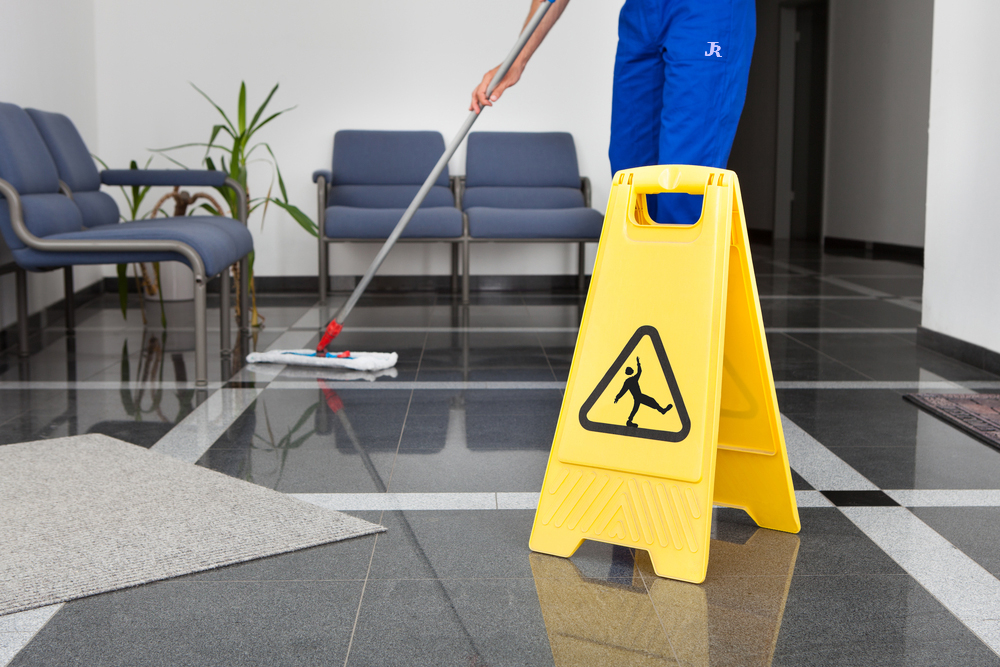 Office Cleaning london Sheffield Rotherham doncaster barnsley south yorkshire wet floor with slip warning sign